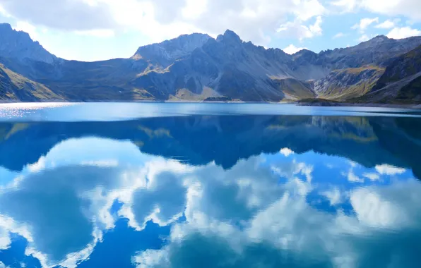 Picture the sky, clouds, mountains, reflection, pond, blue tones