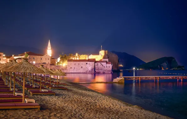 Picture sand, sea, beach, the sky, mountains, night, lights, rocks, coast, home, pierce, sunbeds, Montenegro, Budva