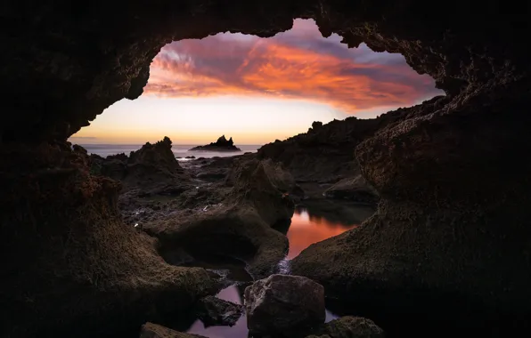 Picture sea, clouds, sunset, darkness, stones, rocks, shore, view, arch, cave, entrance, arch, вид из пещеры