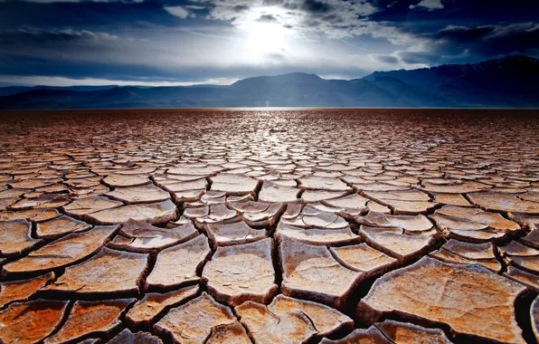 Picture the sky, mountains, cracked, earth, desert, drought