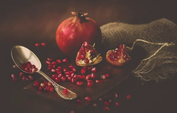 Picture the dark background, garnet, pomegranate grains
