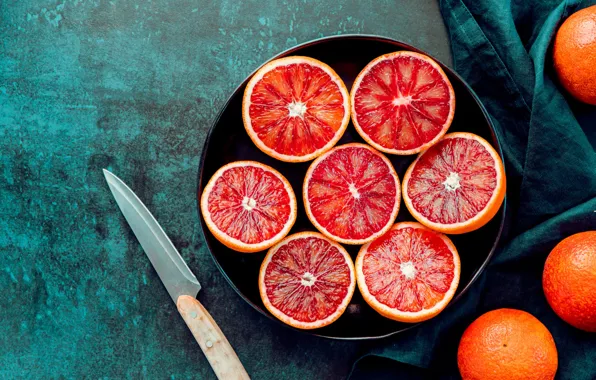 Picture table, knife, fabric, bowl, fruit, green background, grapefruit, tangerines, citrus, grapefruit, in half, cut