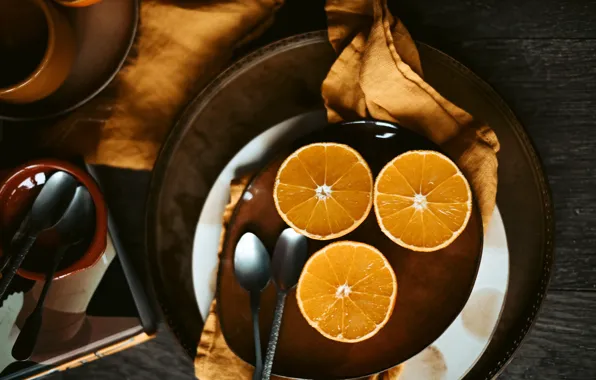 Picture the dark background, table, Board, towel, oranges, plates, dishes, trio, spoon, serving