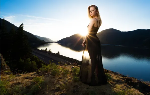 Picture Girl, is, in the background, in a black dress, mountains