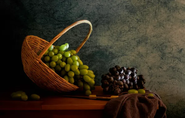 Picture the dark background, table, grapes, knife, fabric, fruit, still life, basket