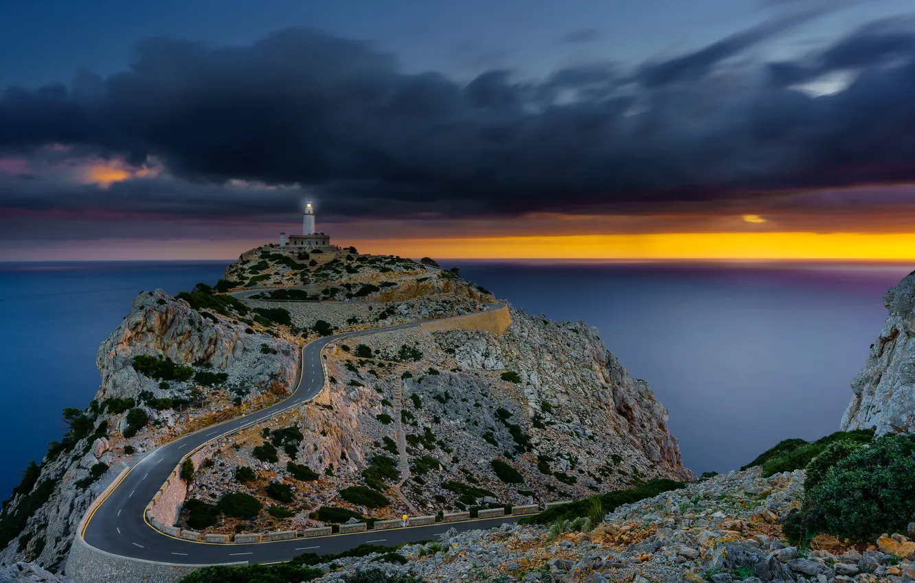 Photo wallpaper road, sea, the sky, clouds, stones, rocks, dawn, coast, lighthouse, horizon, Spain, Mallorca, Mallorca, Sunrise