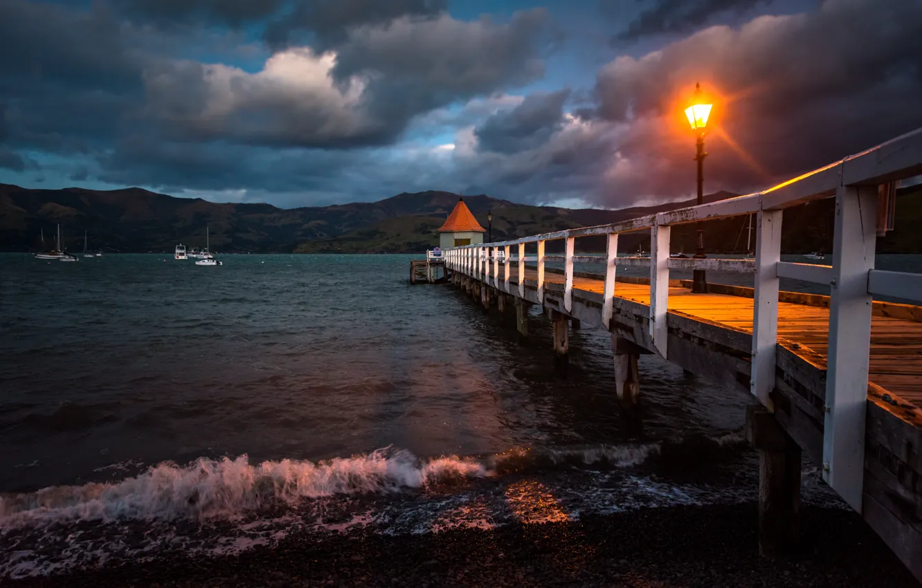 Photo wallpaper sea, rays, light, landscape, mountains, clouds, storm, nature, pier, New Zealand, lantern