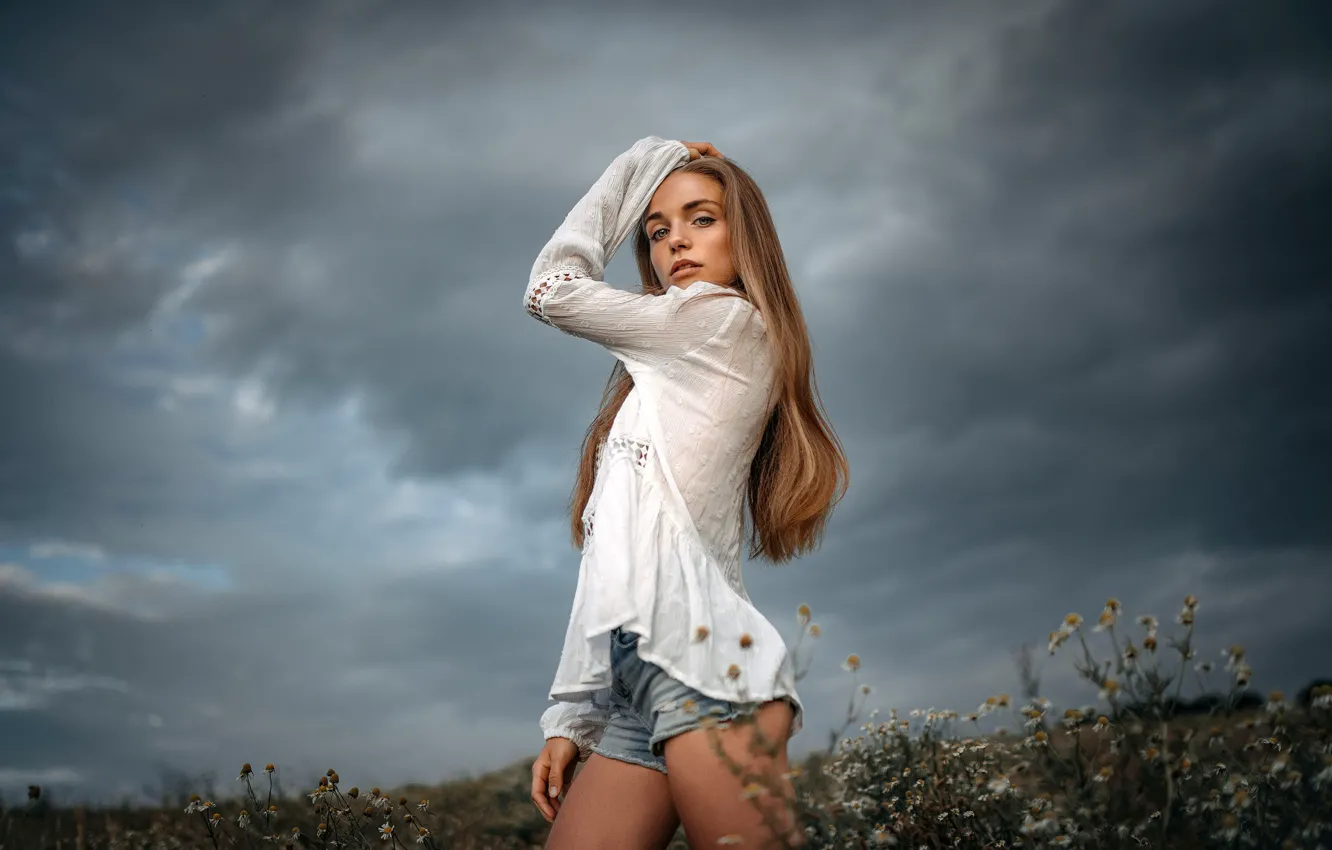 Photo wallpaper field, the sky, look, flowers, clouds, model, shorts, portrait, chamomile, makeup, figure, hairstyle, blouse, beauty, …