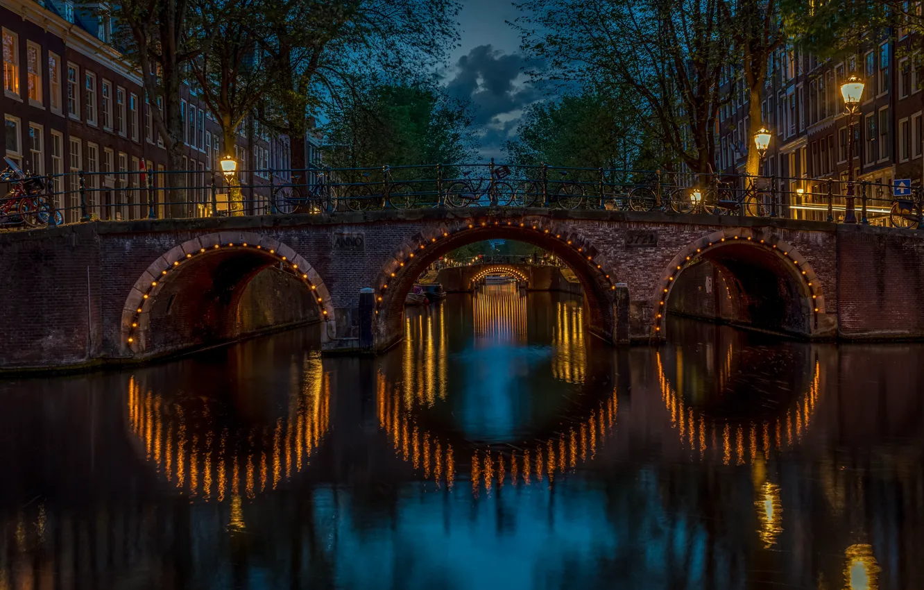 Photo wallpaper trees, bridge, building, home, Amsterdam, lights, channel, Netherlands, night city, Amsterdam, bikes, illumination, Netherlands, Канал …